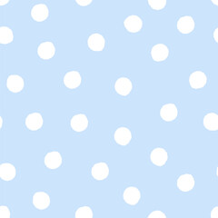 Seamless polka dot pattern with irregular white dots on light blue background. Simple hand-drawn geometric design. Retro and baby shower concept for textile, wallpaper and print.