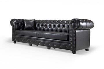 Close-up detail of a classic armchair's corner, featuring black leather upholstery, brass nailhead...