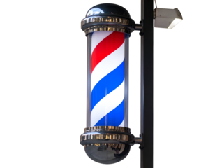 An illuminated barber pole with its iconic red, white, and blue helix design signals a traditional barbershop.
