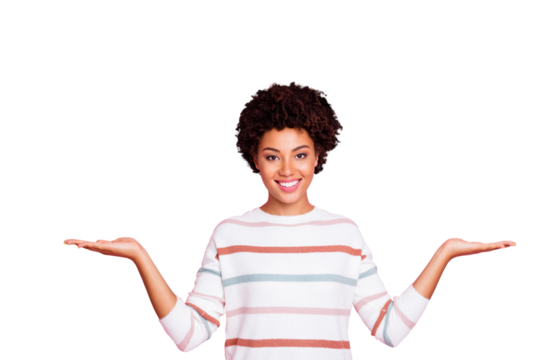 Photo of cheerful cute fascinating toothy black promoter showing you two sides advantages of object held with her hands wearing sweater white striped isolated over pastel color background