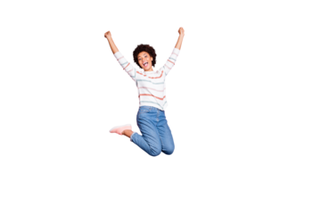Full length body size photo of cheerful cute charming positive sweet pretty black millennial jumping up with happiness wearing jeans denim white striped sweater isolated pink pastel color background