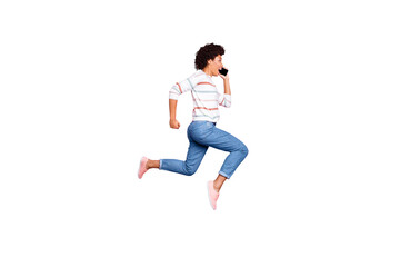 Full length body size photo of cheerful cute charming nice runner amazed astonished surprised shocked stunned in jeans denim jumping isolated over pink pastel color background