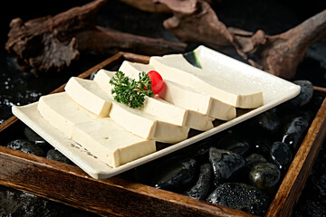 A plate of fresh soft tofu slices