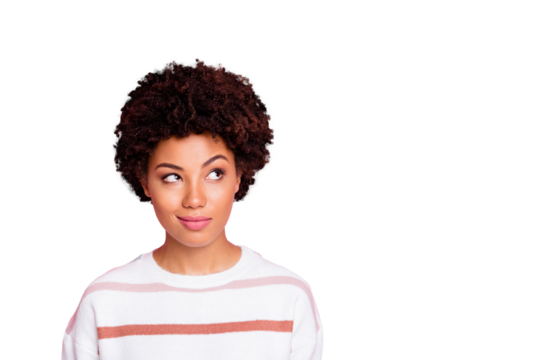 Photo of curious sly black skinned girl glancing at empty space wearing striped white sweater planning her life isolated over pink pastel color background