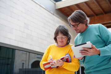Elderly teacher and student engaged in outdoor learning