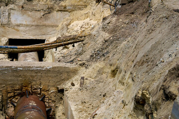 Dug hole with metal water sewer pipes for repair,replacement