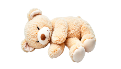 Stuffed teddy bear lying down with soft fur on a white background  
