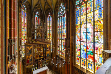 Obraz premium Impressive stained glass windows illuminating gothic church interior in Spissky Stvrtok, Slovakia
