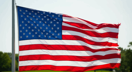 The American flag waving proudly under a clear sky, embodying national pride