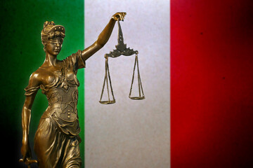 Lady Justice before a flag of Italy
