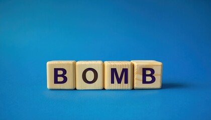 wooden blocks spelling bomb against a blue background symbolizing war and conflict, ideal for educational or awareness content