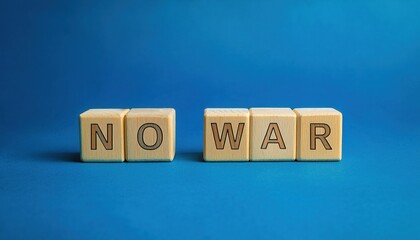 wooden blocks spelling no war on blue background, anti war message for social activism, peace campaign, or educational use