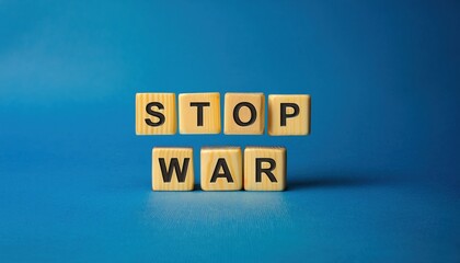 wooden letter blocks spelling stop war on a blue background, symbolizing peace and anti war message, perfect for advocacy or awareness campaigns