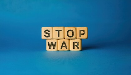 wooden letter blocks spelling stop war on a blue background, symbolizing peace and anti war message, perfect for advocacy or awareness campaigns