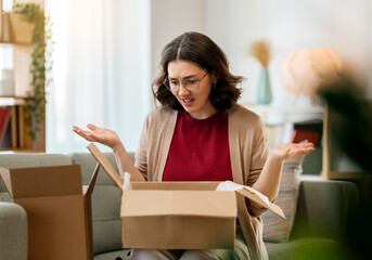 Woman is unpacking cardboard