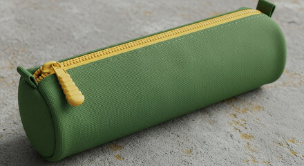 Blank green pencil case with yellow zipper on a grey background