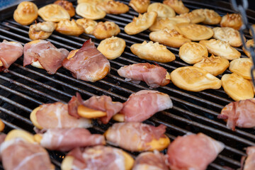 Traditional Polish street food, Oscypek - smoked sheep cheese on a grill, sold at the Christmas market