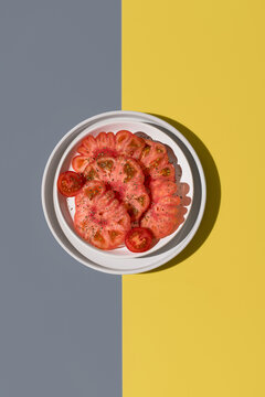 Top view of raf tomato with spices on a plate