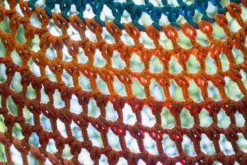 Colorful climbing net in an adventure park setting