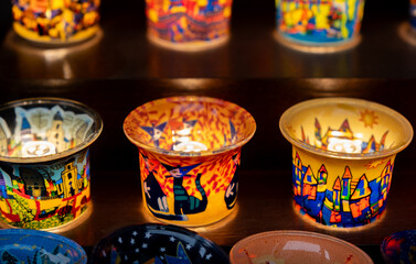 Christmas souvenirs - painted candle holders for sale at a traditional European Christmas market