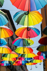 Multicolored umbrellas on the streets of Madrid, Spain