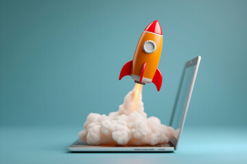 A small red and orange rocket blasts off from a laptop keyboard, symbolizing innovation and technology launch.