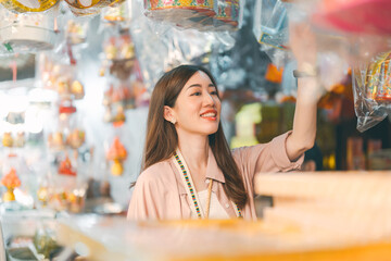 Woman solo travel at chinese local culture market product at shop vendor