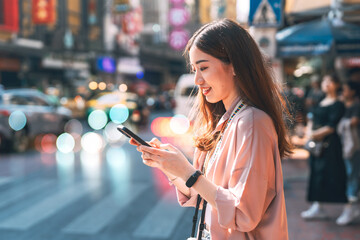 Asian woman using smartphone internet 5g solo local travel in southeast asia