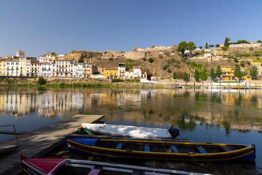 Colorful boats resting on the Ebro River in Mora d'Ebre, Catalonia, Spain