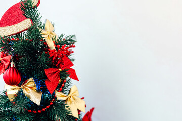 Christmas tree decorations in vibrant red and gold hues create a festive atmosphere