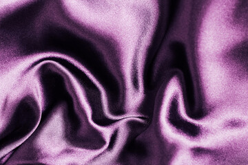 Soft purple satin fabric draped elegantly creating gentle ripples and folds