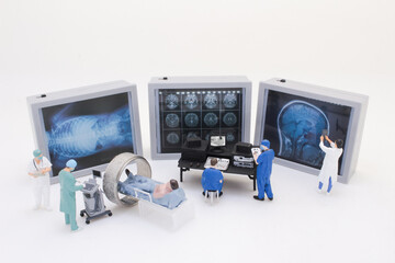 A Miniature Medical Team Analyzing Diagnostic Imaging