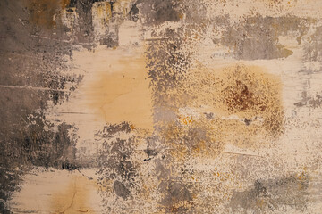 Textured wall with peeling paint and abstract patterns in neutral colors