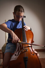 Young Girl Practicing Cello with Focus and Determination in a Minimalist Room