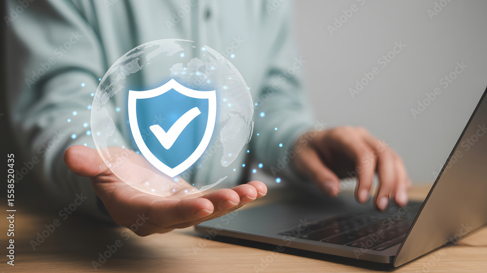 Aufkleber protecting digital assets is key, with a secure shield icon in hand while working on a laptop, ensur