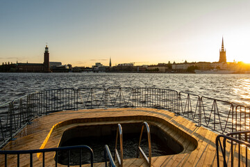 Stockhom, Sweden A wooden tub and ladder at dawn in the Riddarfjarden Bay for swimmers and city...