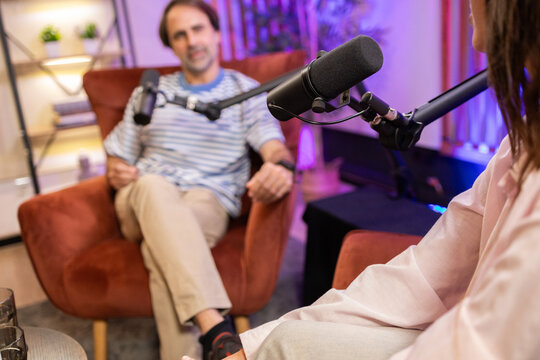 Modern podcast conversation in cozy studio setting