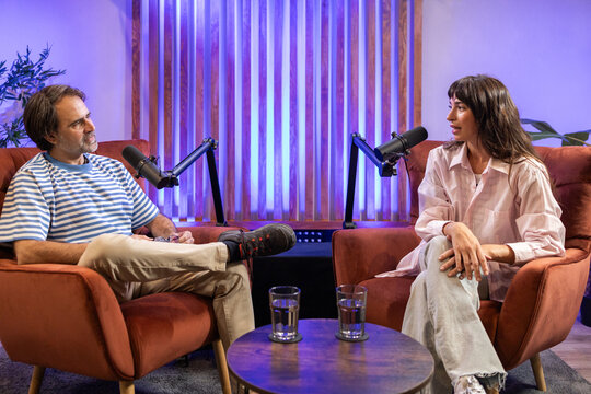 Intimate podcast recording studio with interview setup