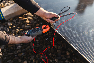 Rooftop solar panel installation with technician