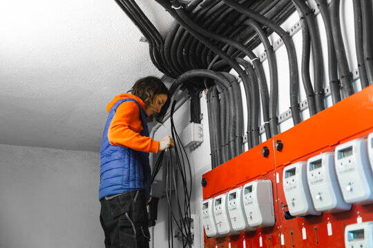 Technician working on solar panel installation cables