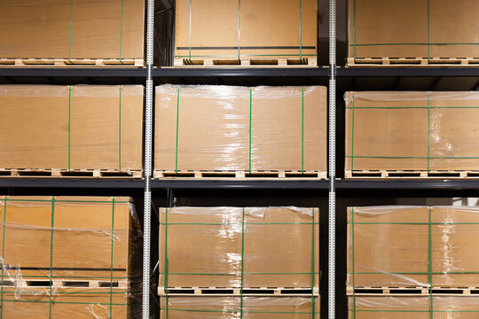 Solar panels stored on industrial warehouse shelves