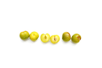 Fresh green plum fruit on white background.