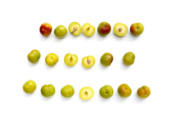 Fresh green plum fruit on white background.