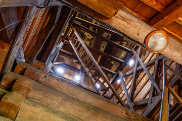 Wooden Ladder Leading Up Inside Belfry of Historic Wooden Church in Sekowa, Poland