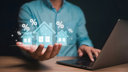 Man researches mortgage rates on laptop with home icons showing interest rates, presenting a financial real estate analysis for buyers.