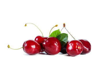 Ripe juicy cherry with  leaves isolated on white background.
