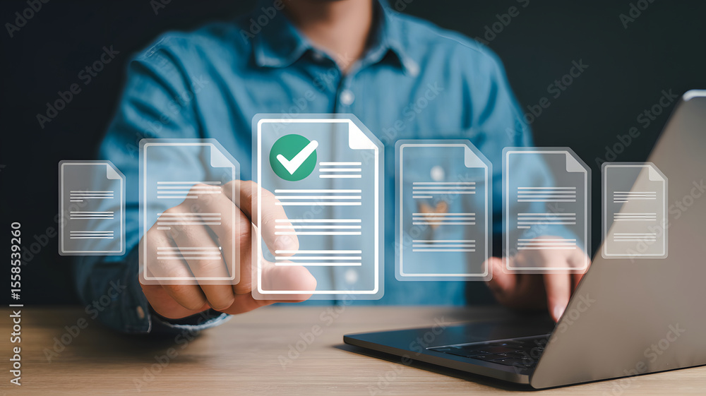Poster man interacting with digital documents, selecting an approved file on a laptop, showcasing business 