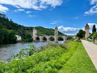 Panoramic view of famous medieval Valentre bridge in Cahors, France. Medieval stone bridge with...