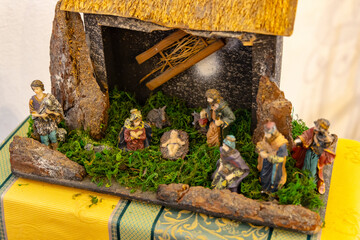 Nativity scene depicting Jesus Christ birth with Mary, Joseph, shepherds and magi bringing gifts