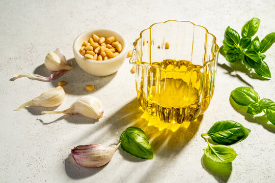 Olive oil and ingredients from above on white background